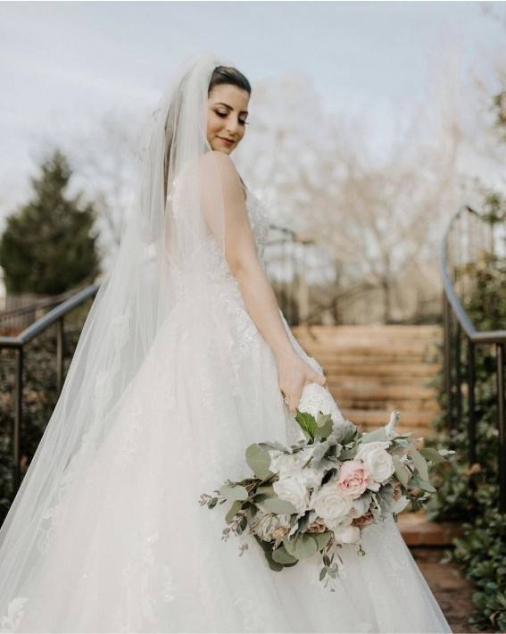 Photo of the model wearing a white bridal gown