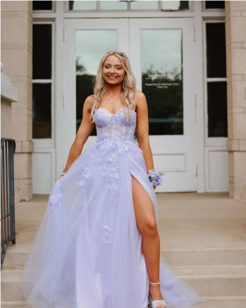 Photo of the model wearing a blue bridal gown